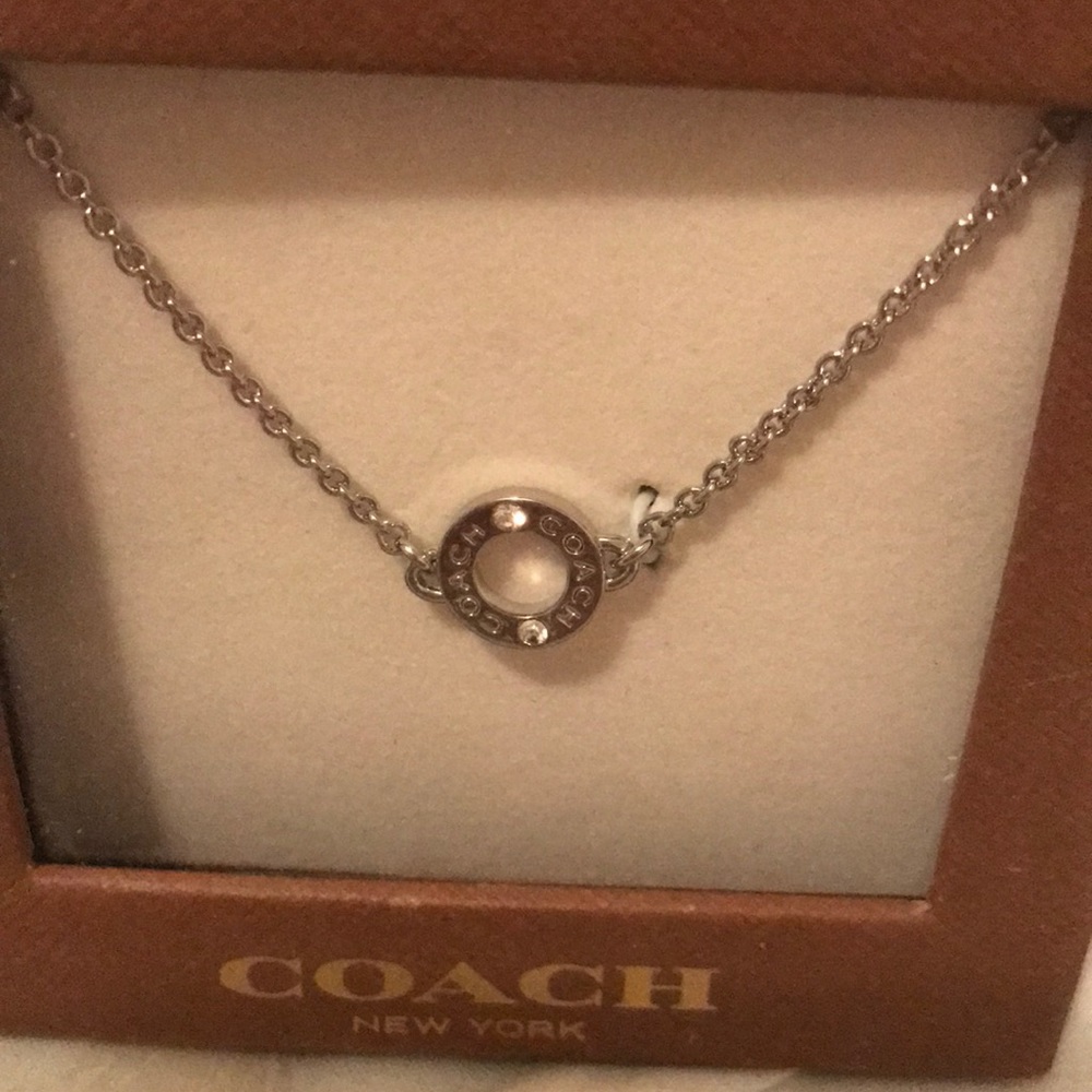 Never worn Coach silver necklace